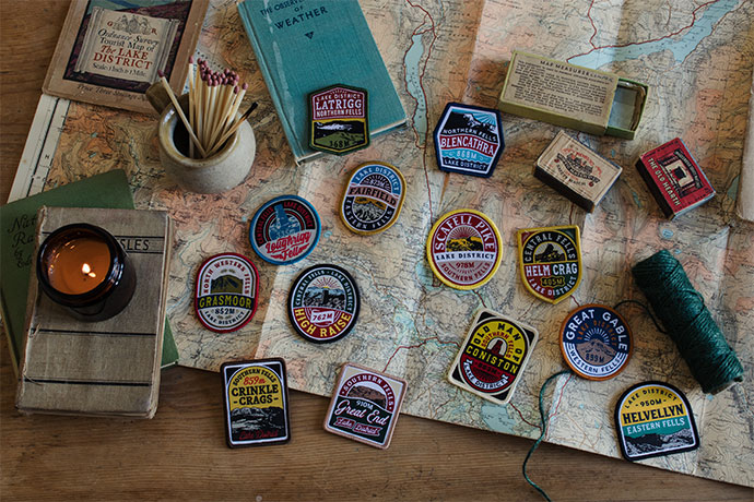 Adventure Patches on table with map and candle